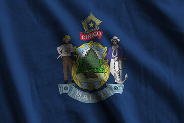 Maine US state flag with big folds waving close up under the studio light indoors. The official...