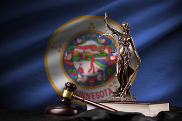 Minnesota US state flag with statue of lady justice, constitution and judge hammer on black...