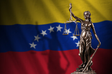 Venezuela flag with statue of lady justice and judicial scales in dark room. Concept of judgement...