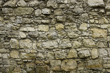 Texture of stone wall with many big brown stones