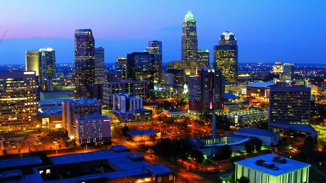 Aerial Panning Shot Of Tall Modern Buildings In Financial District During Dusk - Charlotte, North Carolina