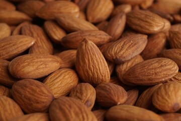 Pile of delicious raw ripe almonds, closeup