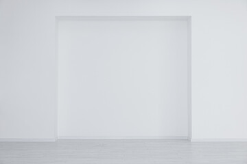 Empty room with niche in white wall during repair