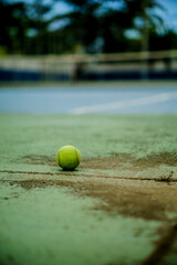 tennis ball on the court of player playing indoor tennis at a sports club during the summer professionally in a championship