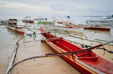 Fototapeta na wymiar Beach with traditional fishing boat, Philippines.