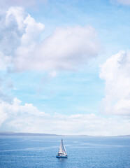 Seascape with white yacht sailing the sea