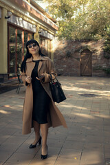 Middle-aged business woman wearing fashionable fall outdoors