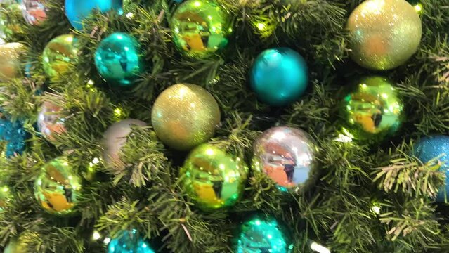 Christmas tree decorated with yellow and green blue toy balls and lights YVR Vancouver airport