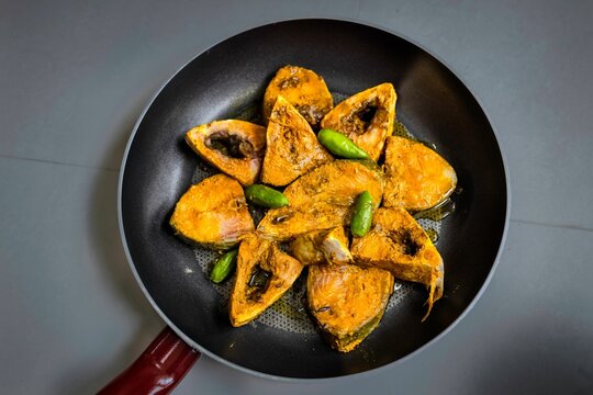 Raw uncooked marinated piece of Ilish fish