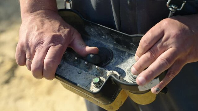 Pressing joystick on cement mixer remote