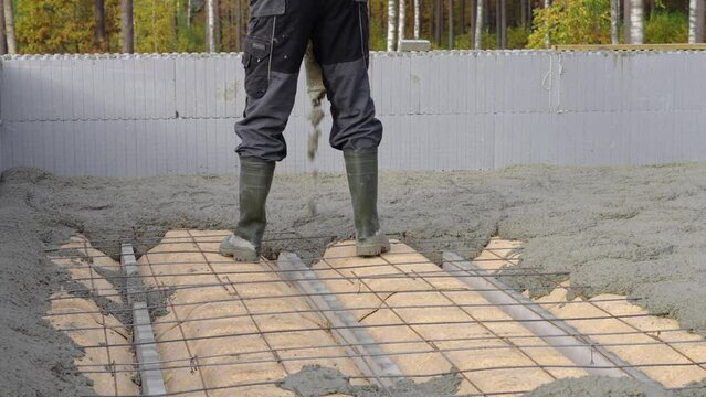 Pouring cement on roof fixture, ICF blocks.
