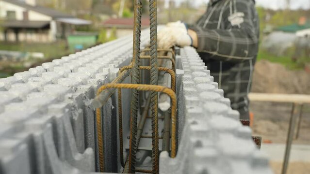 Placing steel cage in ICF block
