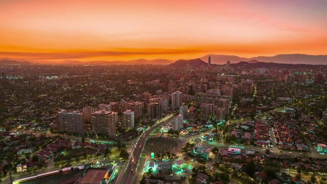 Roundabout Aerial Hyperlapse, Neon City Night Lights, Violet Golden Sunset Chile Downtown Car Traffic, Skyscrapers Vibing Andean Cordillera