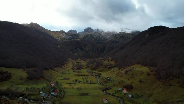 Alpine village of Lepushe in Albania in Autumn, meadows and forests surrounded by rocky mountains