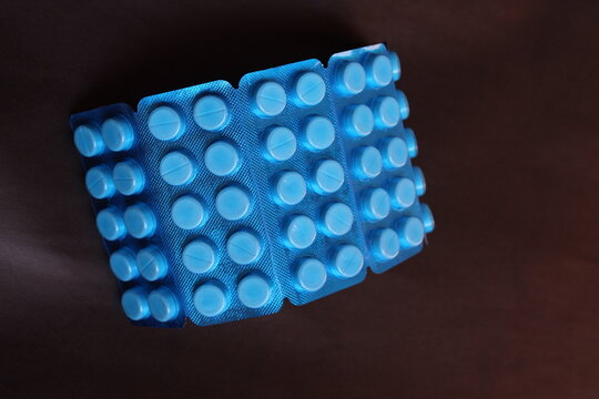 Paracetamol tablets package on a plain background used for fever