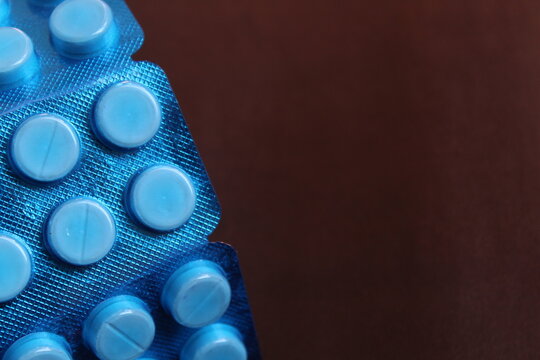 Paracetamol tablets package on a plain background used for fever
