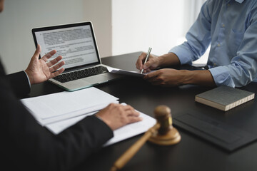 Fototapeta premium Lawyer with lawsuit meeting with client discussing with contract agreement at courtroom..