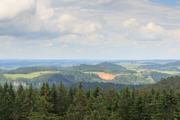 Panorama view of Eifel mountains with castle Kasselburg and trees seen from hill Heiligenstein near...
