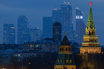 Moscow, Russia, evening view of the fortress towers of the Kremlin and the skyscrapers of Moscow City.