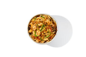 Asian fried noodles with chicken and vegetables isolated on white background Chinese fried noodles with chicken meat and shiitake mushrooms in ceramic bowl. Stir-fry udon with vegetables and meat