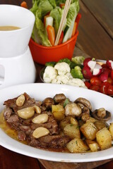 Roast beef with potatoes, mushrooms and garlic
