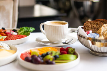 Luxury hotel and five star room service, various food platters, bread and coffee as in-room...