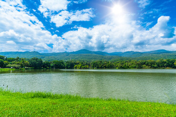 a public place leisure travel landscape lake views at Ang Kaew Chiang Mai University and Doi Suthep nature forest Mountain views spring cloudy sky background with white cloud.