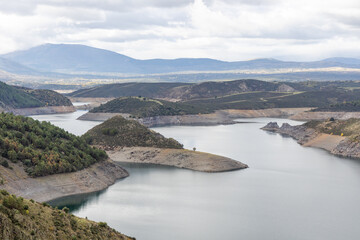 Fototapeta na wymiar view of the reservoir called El Atazar in Madrid with very low water level due to drought and climate change