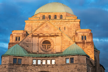 Sunset view of the dome of the picturesque restored synagogue in the city of Essen. Religion and the Jewish community in Germany