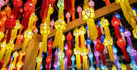 The light of the Beautiful Colorful Lanna lamp paper lantern background pattern are northern thai style lanterns in Chiang Mai Thailand.full moon the 12th month Be famous.