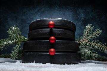 Heavy dumbbell barbell weight plates stacked on top of each other in the shape of a snowman....