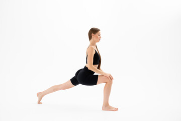 Fototapeta na wymiar Beautiful brunette fitness woman doing yoga on a white background