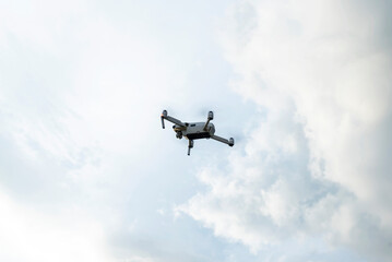 Unmanned aircraft flying in the sky. Testing an aerial unmanned vehicle in nature