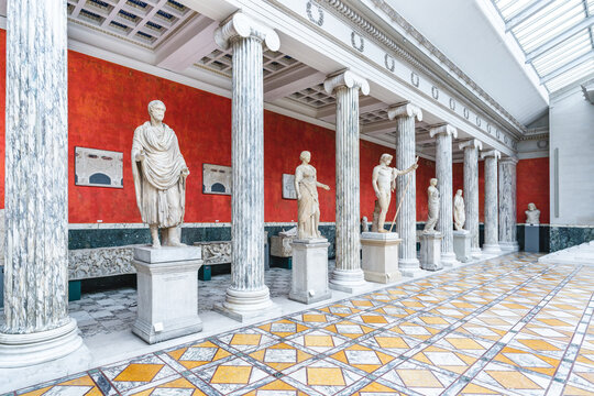 Copenhagen, Denmark. Circa September 2022. Interior hall of the Ny Carlsberg Glyptotek with statues and columns. Roman and greek marble sculptures