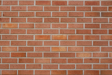 a red brick wall in a residential area