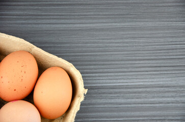 Chicken eggs on wooden background