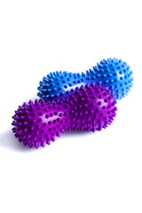 Blue and purple double or peanut spikey balls massager for yoga pilates or stretching and fascia pain. Sports equipment for fitness isolated on a white background. Concept of sports massage. 