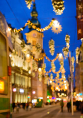 Obraz premium Blurred background with evening city view and lights