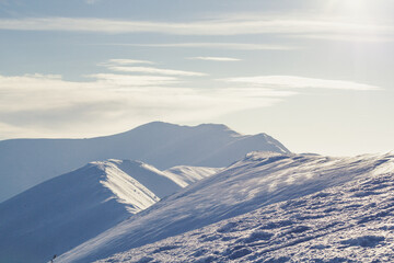 Steep slope mountains with peaceful sky landscape photo. Beautiful nature scenery photography with horizon on background. High quality picture for wallpaper, travel blog, magazine, article