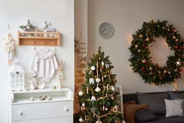 Winter holidays and vacations. Christmas and New Year decor background. Christmas tree and toys. Nursery Christmas decoration. Children's room interior.
