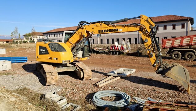 Udine, Italy. November 24, 2022. Brand new Liebherr excavator at work in the construction site