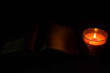 a candle and a notebook