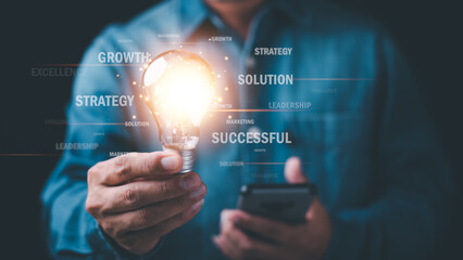 Businessman holding light bulb showing business strategy concept,development concept, business efficiency and growth, financial and economic success goals,Industry Leadership and business competitors