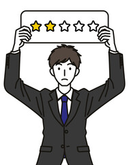 星2つの札をもつスーツを着た男性