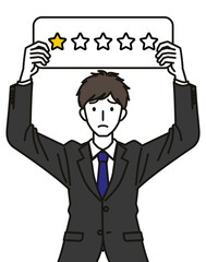 星1つの札をもつスーツを着た男性