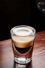 shots with vodka on wooden background