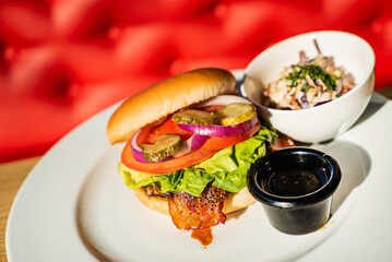burger with salad on summer terrace