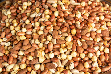 Background texture of assorted mixed nuts including cashew nuts,