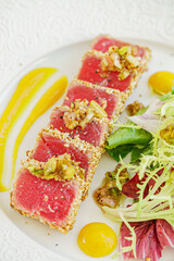 sliced tuna steak with sesame and vegetables