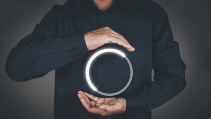 Man with glowing loading circle digital interface.